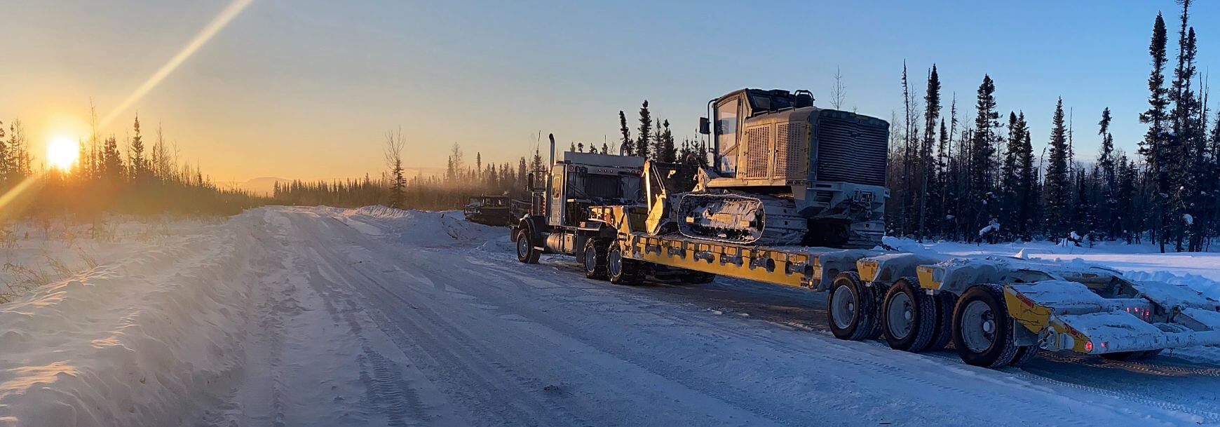 Truck and trailer at sunrise